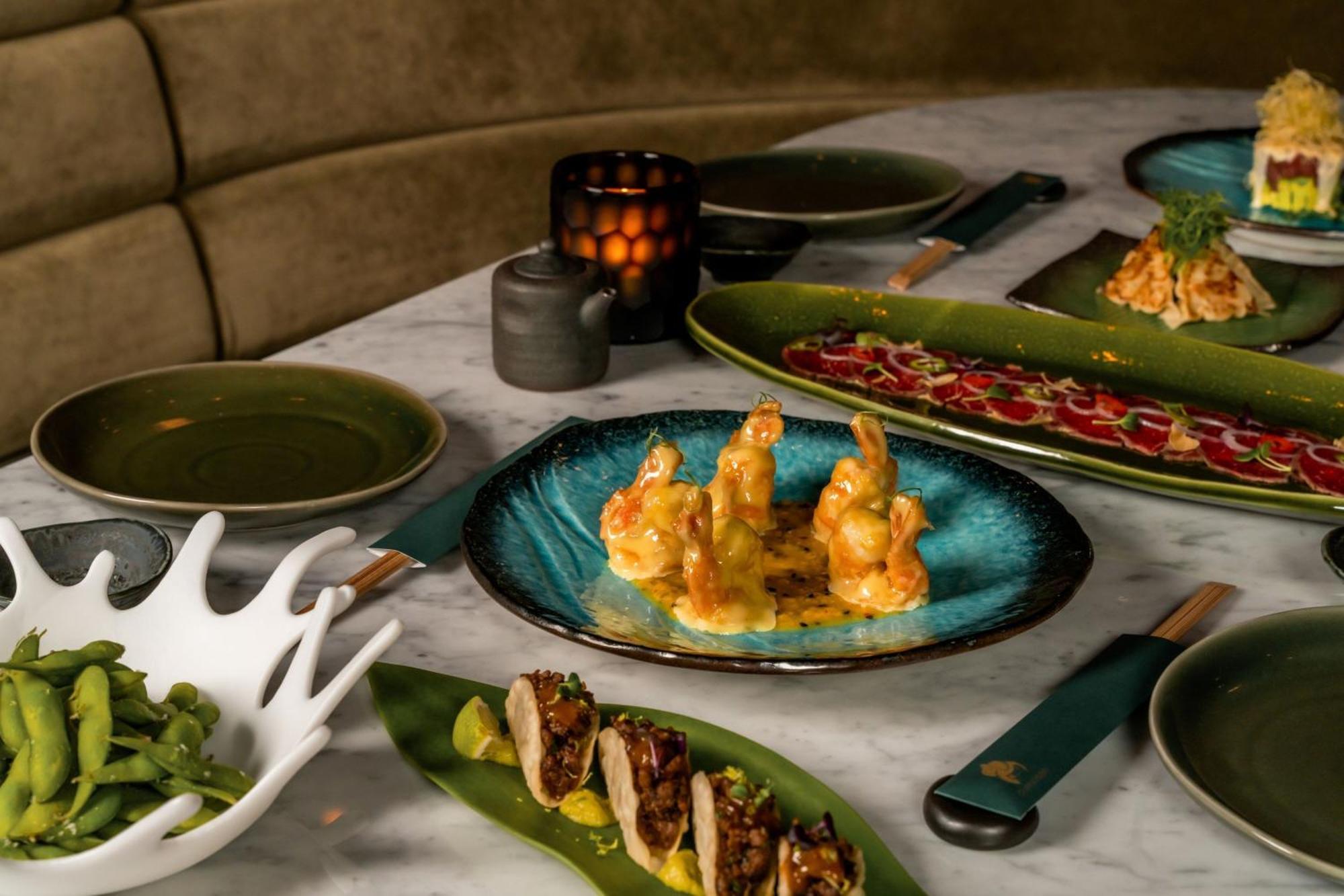 The Dubai Edition Zewnętrze zdjęcie A selection of dishes at the restaurant
